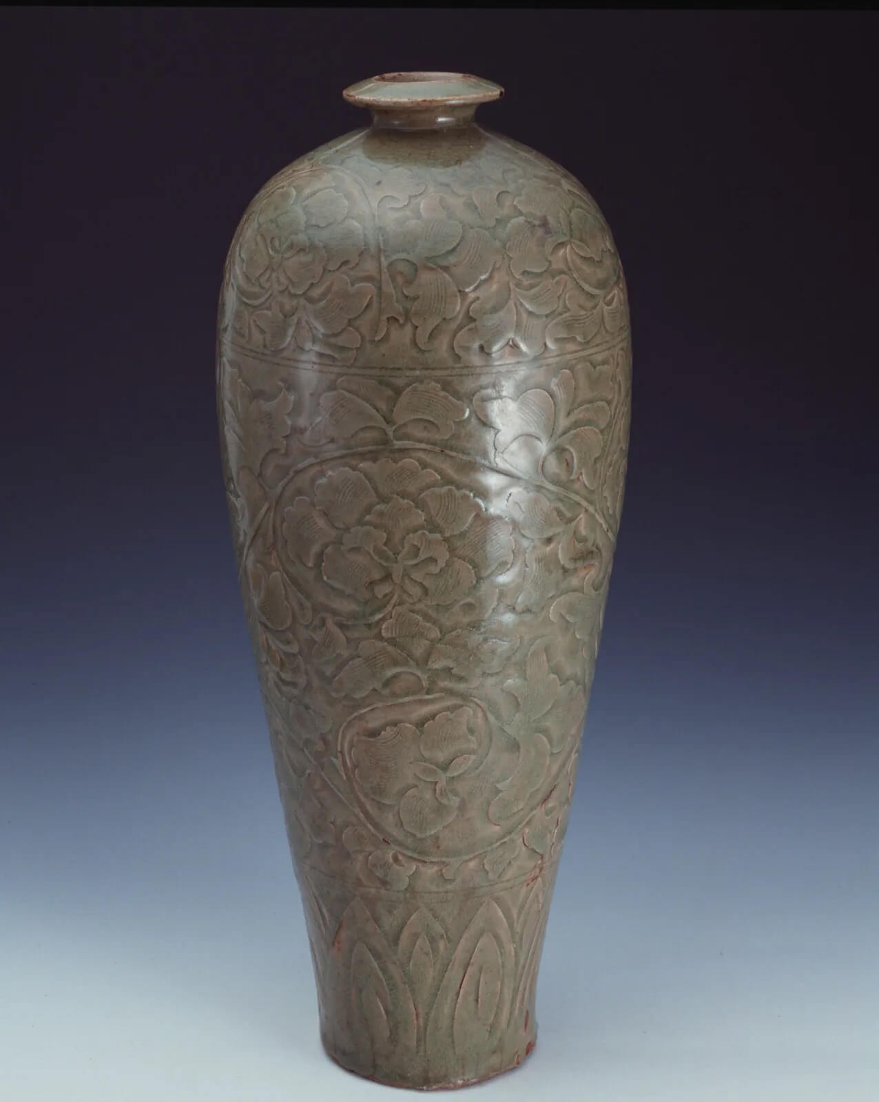 Celadon vase with carved interlaced peonies design. Yaozhou ware. Northern Song (AD 960-1127) Shanghai Museum Ancient Chinese Ceramics Gallery.